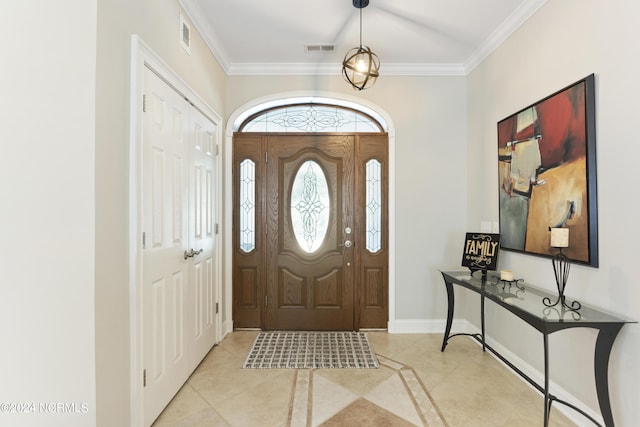 foyer featuring ornamental molding