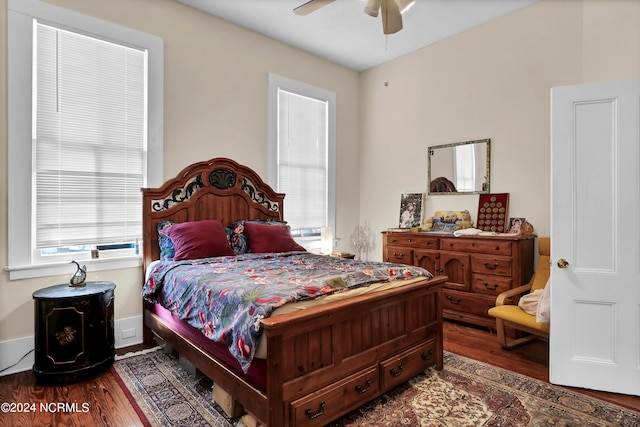 bedroom with wood-type flooring, multiple windows, and ceiling fan