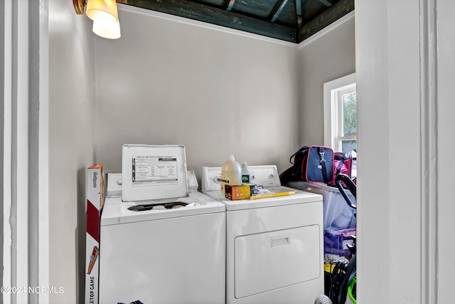 laundry room featuring washing machine and clothes dryer