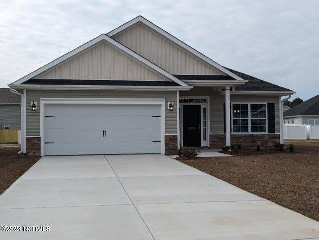 craftsman house with a garage