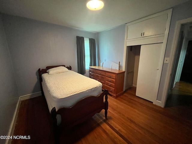 bedroom featuring wood finished floors