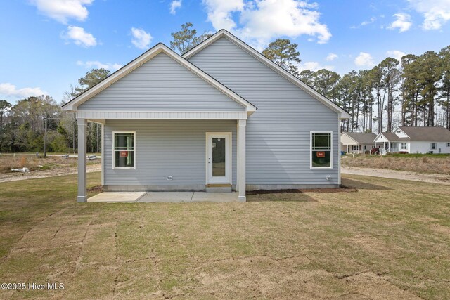 308 Camp Creek Dr, Oriental, NC 28571 - rear view of property with a patio and a yard