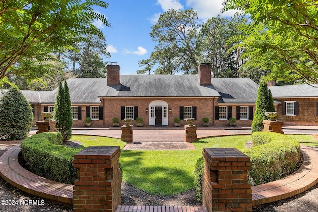 ranch-style house with a front lawn