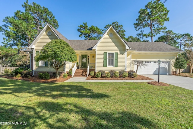 view of front of property featuring a garage, covered porch, and a front lawn