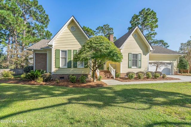 view of front of property with a garage and a front lawn