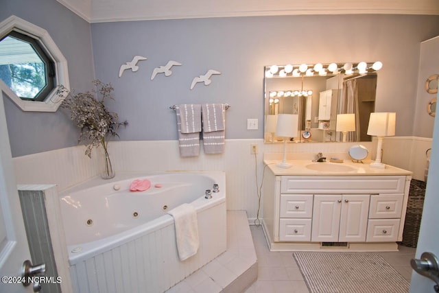 bathroom featuring vanity, tiled bath, crown molding, and tile patterned flooring