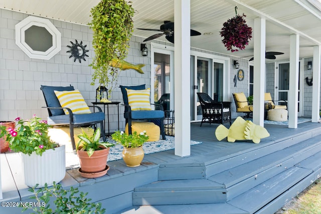 wooden terrace featuring ceiling fan