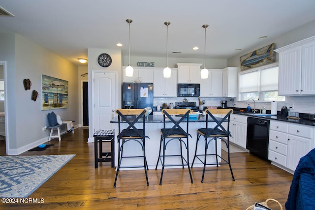 kitchen with a center island, white cabinetry, dark hardwood / wood-style floors, and black appliances