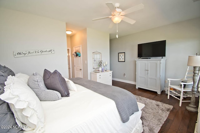 bedroom featuring dark hardwood / wood-style flooring and ceiling fan