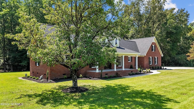 view of front of property with a front yard and covered porch