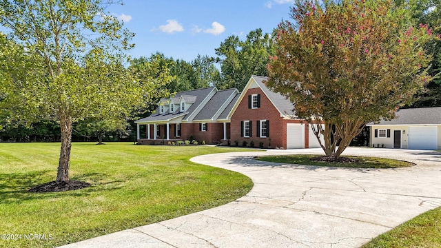 view of front of house with a garage and a front lawn