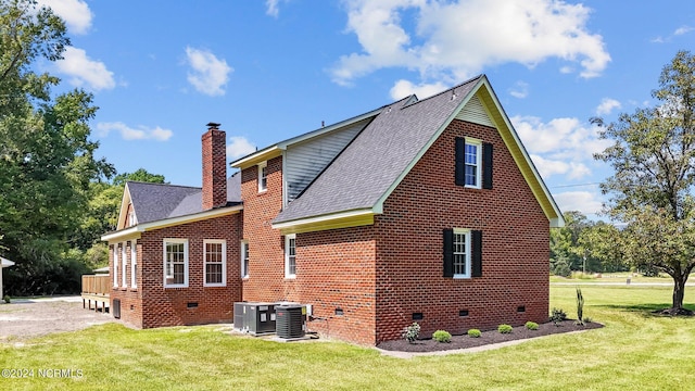 rear view of property with a yard