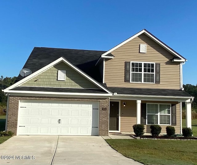 view of front of property featuring a front yard and covered porch