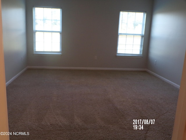 spare room featuring carpet flooring