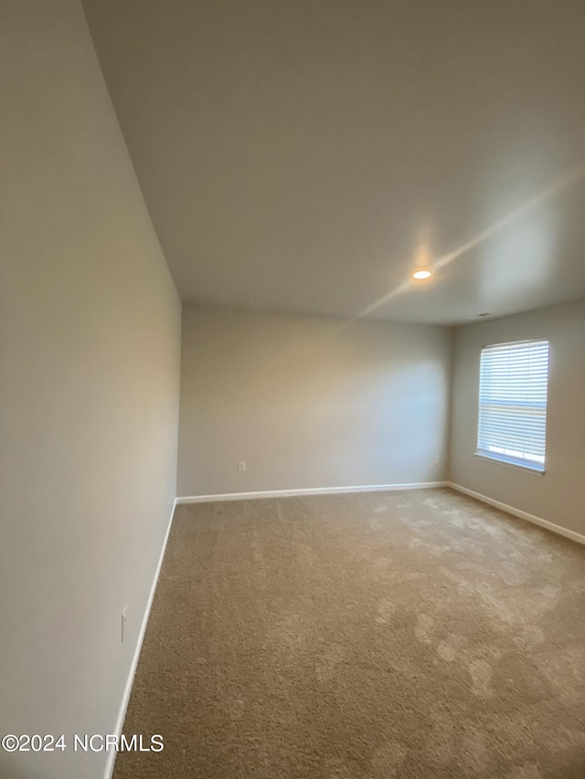 unfurnished room with carpet floors