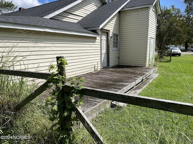 wooden deck with a yard