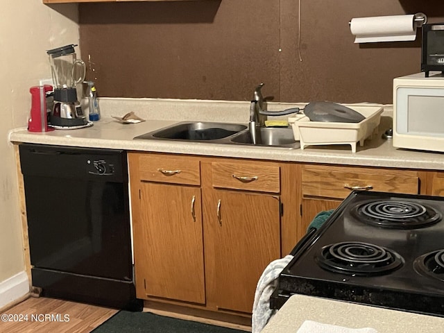 kitchen with black appliances and sink