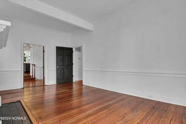 unfurnished room featuring crown molding, beam ceiling, and dark hardwood / wood-style flooring