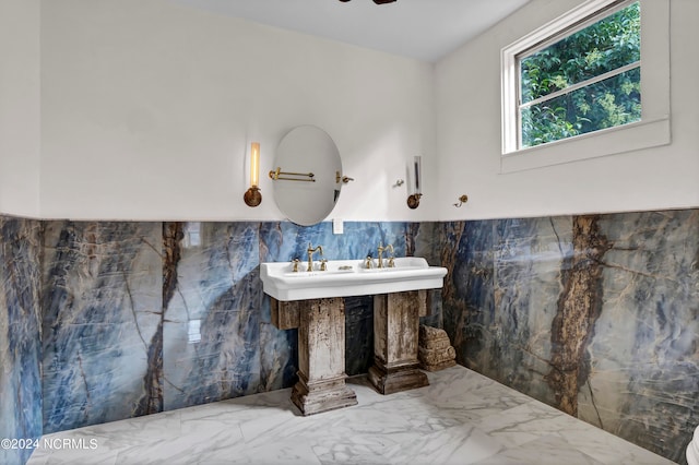 bathroom with tile walls