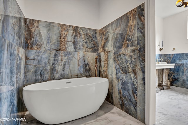 bathroom featuring tile walls and a washtub