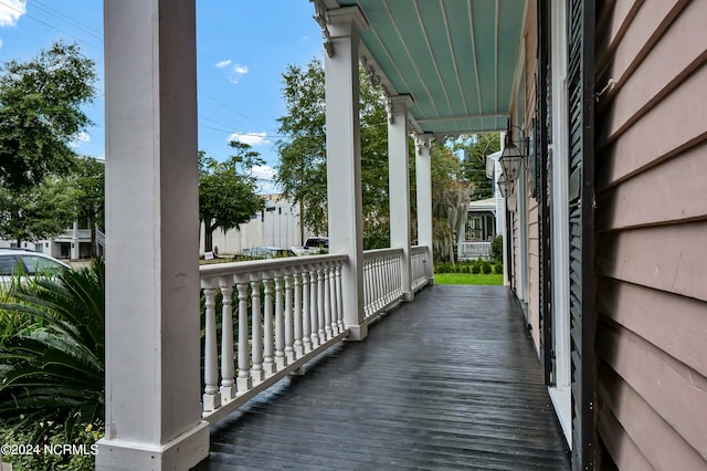 wooden terrace with a porch