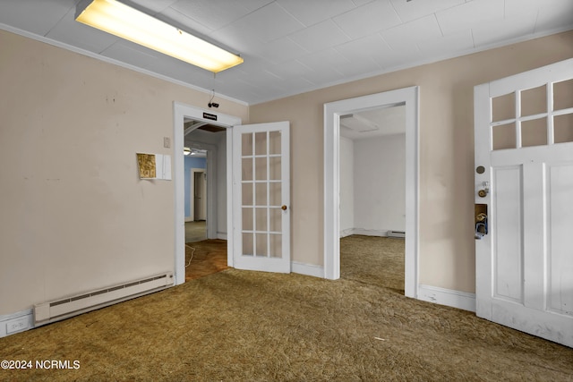 carpeted spare room featuring a baseboard radiator