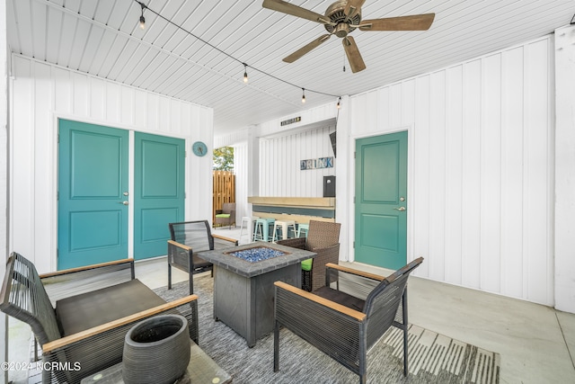 1305 Mackerel Ln Unit 1, Carolina Beach, NC 28428 - view of patio with a fire pit and a ceiling fan