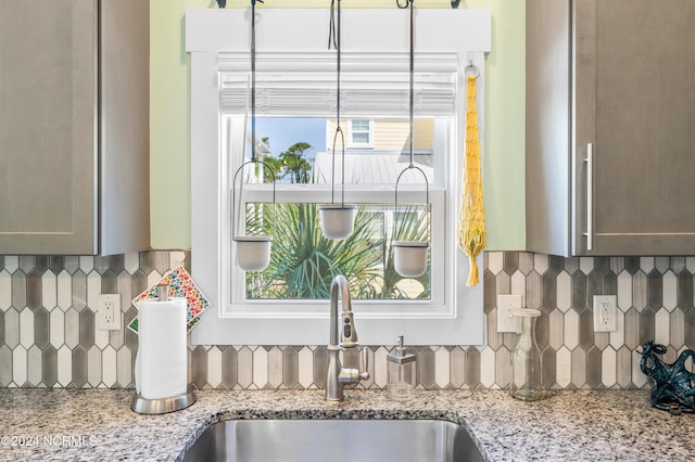 1305 Mackerel Ln Unit 1, Carolina Beach, NC 28428 - kitchen view of tasteful backsplash and light stone countertops