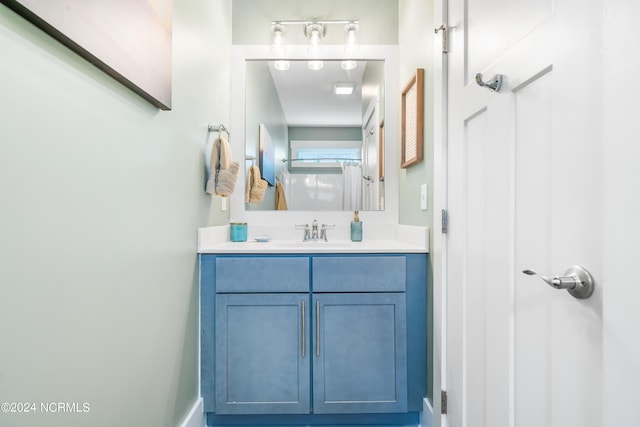 1305 Mackerel Ln Unit 1, Carolina Beach, NC 28428 - full bathroom with vanity and baseboards
