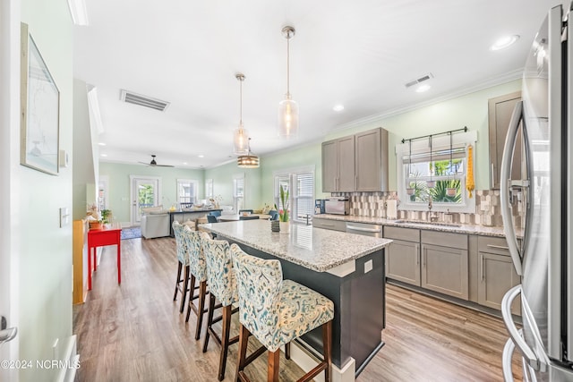 1305 Mackerel Ln Unit 1, Carolina Beach, NC 28428 - kitchen featuring appliances with stainless steel finishes, gray cabinetry, plenty of natural light, a kitchen island, and recessed lighting