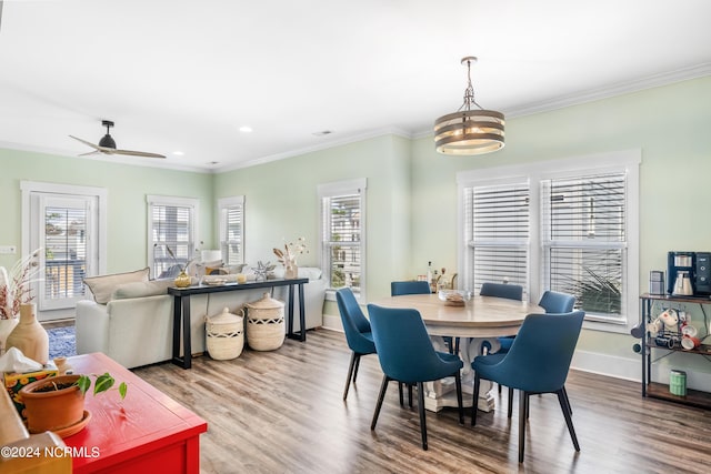 1305 Mackerel Ln Unit 1, Carolina Beach, NC 28428 - dining room with healthy amount of natural light, wood finished floors, crown molding, a ceiling fan, and recessed lighting
