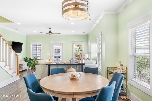 1305 Mackerel Ln Unit 1, Carolina Beach, NC 28428 - dining area with stairs, wood finished floors, crown molding, recessed lighting, and ceiling fan