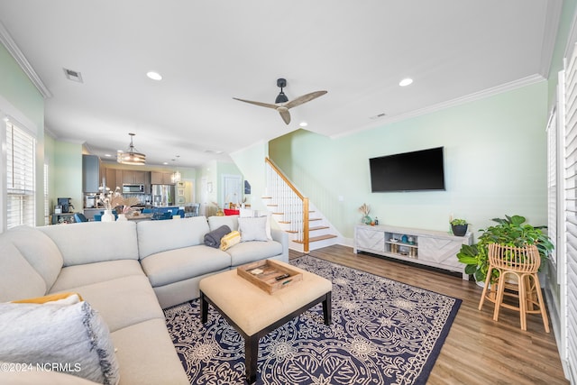 1305 Mackerel Ln Unit 1, Carolina Beach, NC 28428 - living area featuring ornamental molding, wood finished floors, stairway, recessed lighting, and a ceiling fan