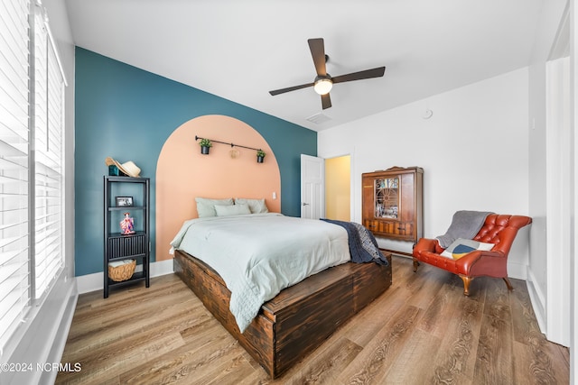 1305 Mackerel Ln Unit 1, Carolina Beach, NC 28428 - bedroom with wood finished floors and a ceiling fan