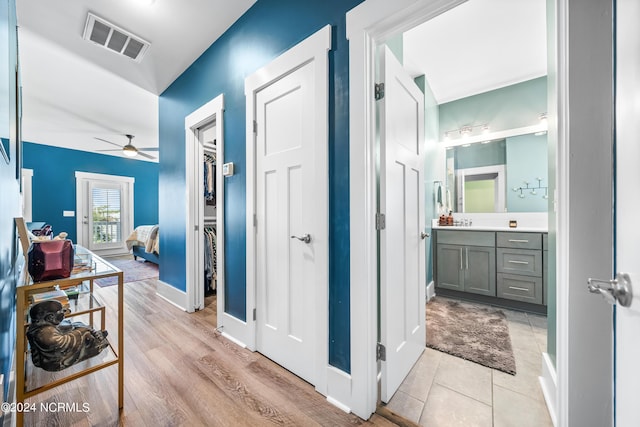 1305 Mackerel Ln Unit 1, Carolina Beach, NC 28428 - hallway featuring baseboards and a sink
