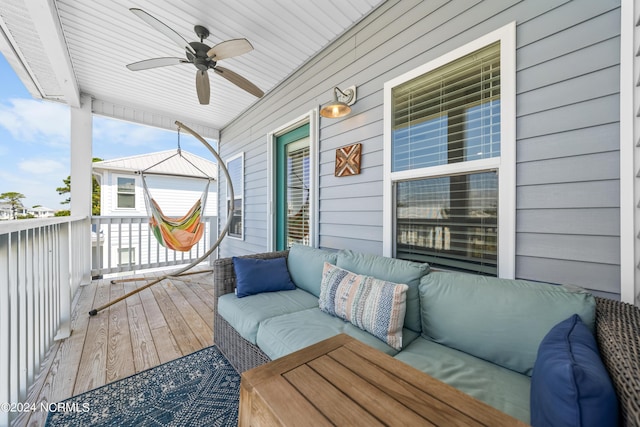 1305 Mackerel Ln Unit 1, Carolina Beach, NC 28428 - porch featuring an outdoor hangout area and a ceiling fan