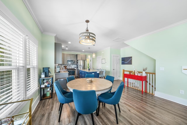 1305 Mackerel Ln Unit 1, Carolina Beach, NC 28428 - dining room with a chandelier, dark wood-style flooring, crown molding, and recessed lighting