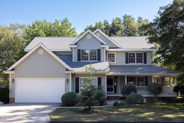 view of front facade featuring a porch and a garage