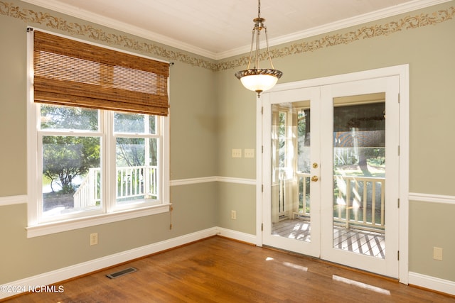 unfurnished dining area featuring hardwood / wood-style floors and plenty of natural light