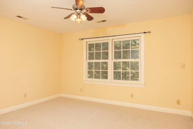 empty room with carpet flooring and ceiling fan