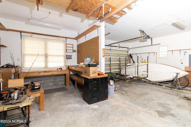 garage featuring a workshop area and a garage door opener