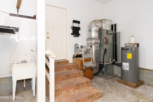 utility room featuring electric water heater