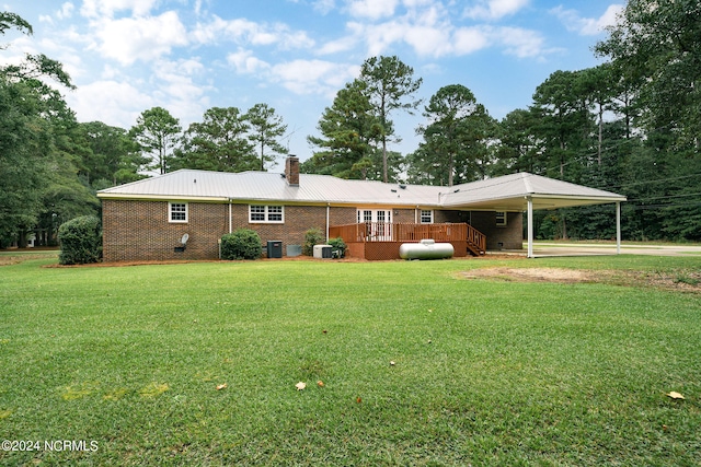 ranch-style house with a front lawn and a deck