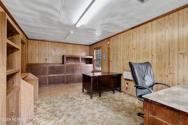 carpeted office featuring wood walls and ornamental molding