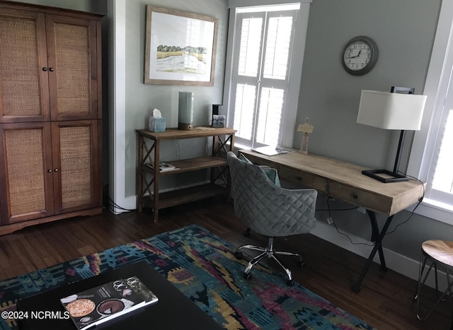 office space with dark wood-type flooring and plenty of natural light