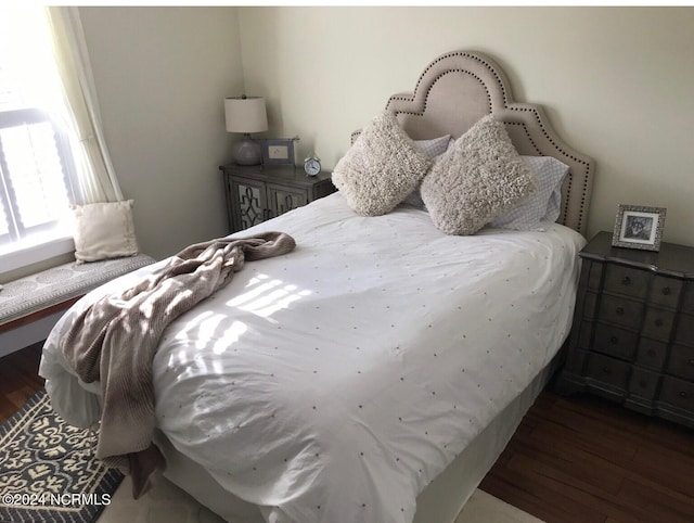 bedroom featuring dark wood-type flooring