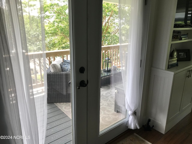 doorway with wood-type flooring