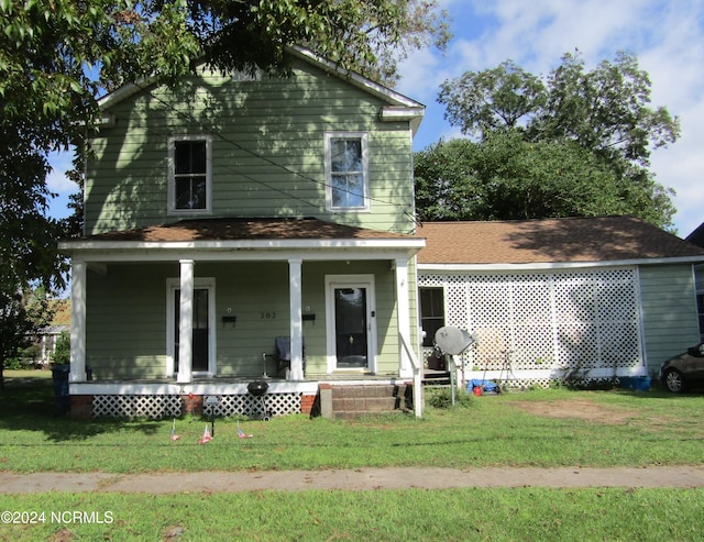 view of front of home featuring a porch and a front lawn