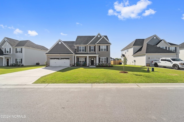 view of front facade featuring a front yard and a garage