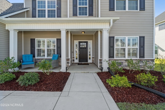 entrance to property with a porch